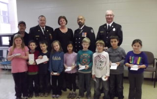 Tilda Raney with students at the first School Smoke Detector Program