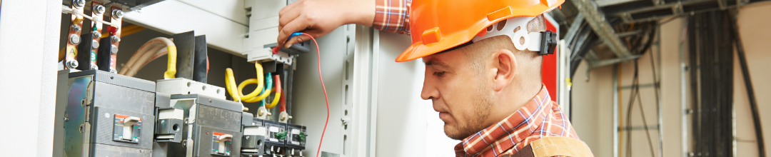 Electrician with an orange hard hat working