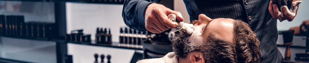 Man getting beard trimmed