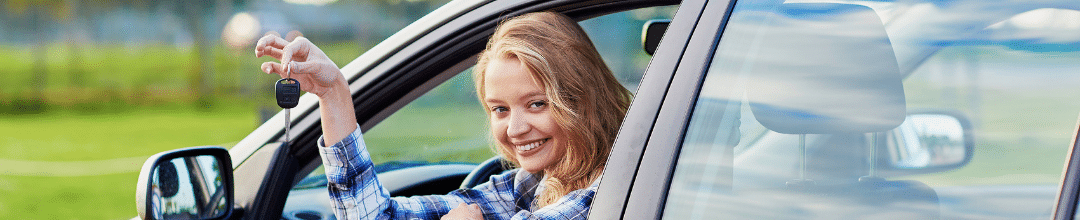 Teenage girl holding up car keys